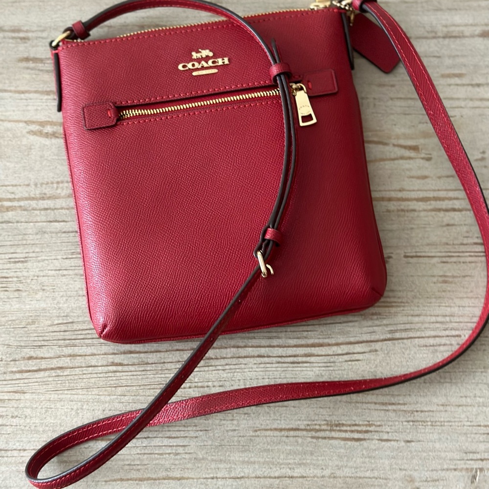 Coach Crossbody bag. 8 1/4 x 8 1/4 x 1 1/4. New w/out tags. Beautiful red.
